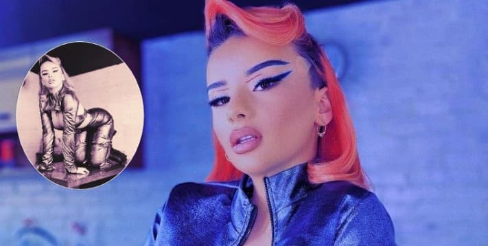 Rina provokon me pozën mbi tavolinë, fokuson gjoksin